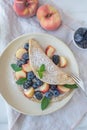 Crepes, thin pancakes or blini with berries Royalty Free Stock Photo