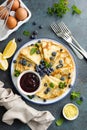 Crepes, thin pancakes with blueberry jam and fresh berries with lemon zest Royalty Free Stock Photo