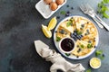 Crepes, thin pancakes with blueberry jam and fresh berries with lemon zest Royalty Free Stock Photo