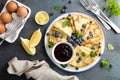 Crepes, thin pancakes with blueberry jam and fresh berries with lemon zest Royalty Free Stock Photo