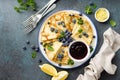 Crepes, thin pancakes with blueberry jam and fresh berries with lemon zest Royalty Free Stock Photo