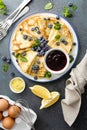 Crepes, thin pancakes with blueberry jam and fresh berries with lemon zest Royalty Free Stock Photo