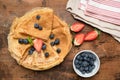 Crepes, thin pancakes or russian blini with fresh berries Royalty Free Stock Photo