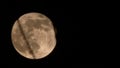 Crescent full moon with a shadow, set against a stark black night sky backdrop Royalty Free Stock Photo