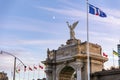 Crescent moon above the Canadian National Exhibition entrance as golden sunset light hits Princes\' Gates during the CNE