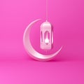 Crescent moon and arabic hanging lamp on pink pastel background studio lighting