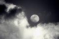 Crescent moon on the night sky seen trough clouds Royalty Free Stock Photo