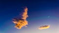 Crescent moon and plane with contrail with orange clouds and moving plane Royalty Free Stock Photo