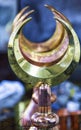 Crescent moon symbol on brass pot