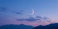 Crescent moon in tranquil twilight over mountain range Royalty Free Stock Photo
