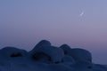 Crescent new moon in winter sky