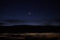 Night with crescent moon and clouds in city Royalty Free Stock Photo