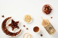 Crescent and star plate with dried dates, arabic lantern, nuts, rosary breads on white table. Ramadan Kareem concept Royalty Free Stock Photo