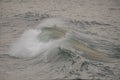 Cresting, curling ocean wave with spray