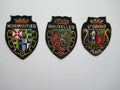 Crests, patches, coats of arms. Souvenirs from France and Belgium. Colorful, shiny and elaborately embroidere