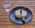 Cretan rusks with local gruyere cheese, olives and a glass of raki