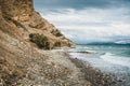 Crete, Greece. beach with rocks and cliffs with view towards sea ovean on a sunny day. Royalty Free Stock Photo