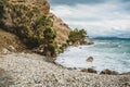 Crete, Greece. beach with rocks and cliffs with view towards sea ovean on a sunny day. Royalty Free Stock Photo