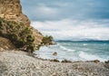 Crete, Greece. beach with rocks and cliffs with view towards sea ovean on a sunny day. Royalty Free Stock Photo