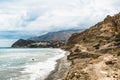 Crete, Greece. beach with rocks and cliffs with view towards sea ovean on a sunny day. Royalty Free Stock Photo