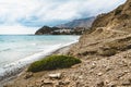 Crete, Greece. beach with rocks and cliffs with view towards sea ovean on a sunny day. Royalty Free Stock Photo