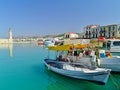 Boats and venetian lighthouse in port