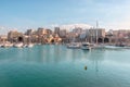 Crete, Greece - February, 11, 2019: Boats and yachts in the port on the background of Heraklion city. Greece