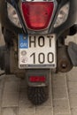 Crete, Greece. 2022. HOT 100 registration plate on an old scooter. Royalty Free Stock Photo