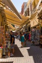 CRETE, GREECE - JULY 03 2023: Crowds of tourists in the old, narrow streets of Chania in western Crete, Greece