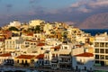 CRETE, GREECE - JULY 10 2023: The lake and harbour area of the town of Agios Nikolaos at sunset (Lasithi, Crete, Greece