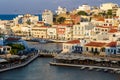 CRETE, GREECE - JULY 10 2023: The lake and harbour area of the town of Agios Nikolaos at sunset (Lasithi, Crete, Greece