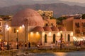 CRETE, GREECE - JULY 03 2023: Long exposure motion blurred image of tourists near the old mosque in the ancient Venetian harbor of