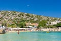 CRETE, GREECE - JULY 01 2023: Swimmers and paddleboarders in the beautiful, clear, shallow waters of Marathi, Chania, Crete