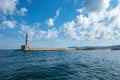 Crete Greece. Lighthouse, beacon at Venetian harbour in Old Town of Chania. Sunny day