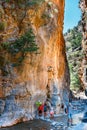 Tourists hike in Samaria Gorge in central Crete, Greece. The national park is a UNESCO Biosphere Rese