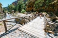 Tourists hike in Samaria Gorge in central Crete, Greece. The national park is a UNESCO Biosphere Rese