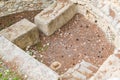 CRETE, GREECE - November, 2017: Pit for sacrifices, laid out with stones, the west courtyard of the Knossos palace Royalty Free Stock Photo