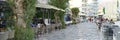 Crete / Greece - September 2019: evening promenade by the sea with cafe tables. banner.