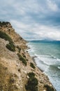 Crete, Greece. View from cliff on Bay with beach and architecture - vacation destination resort with clear ocean water Royalty Free Stock Photo