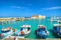 CRETE ISLAND, GREECE, SEP 12, 2012: View on beautiful classic old piscatory small sea boats ships, white yachts, Heraklion Greek s Royalty Free Stock Photo