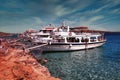 Crete or Kreta, Greece - September 14, 2017: Bunch of cruiser ship docked with tourist and people grilling on mediterranean sea