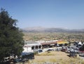 Crete or Kreta, Greece: A wide angle view from top of souvenir shop and cars parked in the middle of deserted