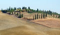 Tuscan Countryside - A typical view of the rolling hills  farm and cyprus trees  Siena Province Tuscany Italy Royalty Free Stock Photo