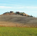 Typical Tuscan landscape of hills  buildings and green cyprus trees  Siena Tuscany Italy Royalty Free Stock Photo