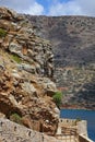 Crete, Spinalonga Island. View on rocks and the wall of the fortress