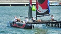 Crew of Alinghi team steering boat at Extreme Sailing Series Singapore 2013