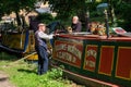 Crew of historic narrowboats chatting at the Shropshire Union Canal