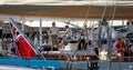 The crew of a luxury sailing ship standing in their ship in palma seaport during the 50th Boatshow fair.a de mallorca seaport wide