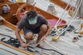 Crew member in action on sailboat