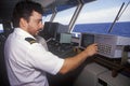 A crew member of the ferry Bluenose piloting the ship through the waters between Maine and Nova Scotia